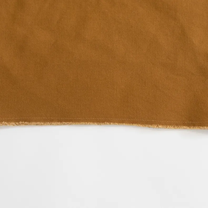 G.K.P Shorter Slip-On Style Apron with fringe finish : Organic Cotton